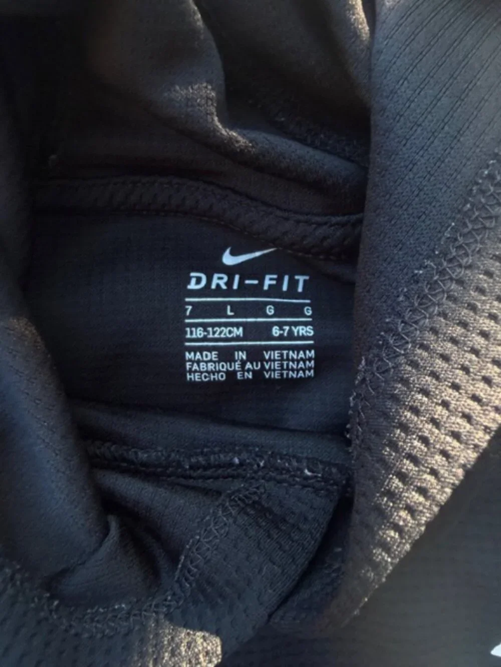 Nike Dri-FIT hoodie featuring a neon yellow swoosh logo and baseball stitching
